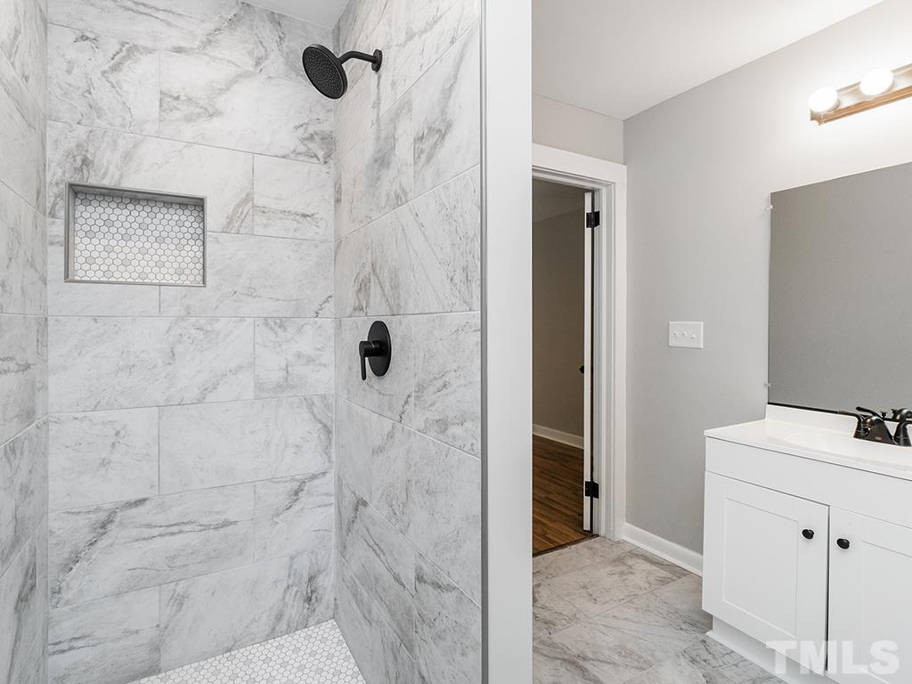 1235 South Main Street Graham, NC 27253 - Photo 19 of 33 a bathroom with a shower