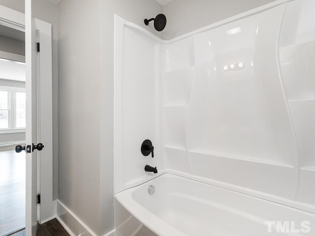 1235 South Main Street Graham, NC 27253 - Photo 22 of 33 a bathroom with a bathtub