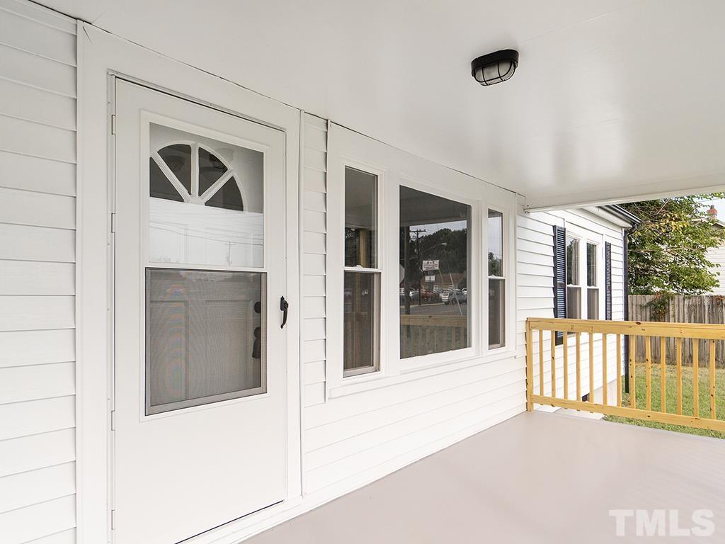 1235 South Main Street Graham, NC 27253 - Photo 3 of 33 a view of a house with a porch