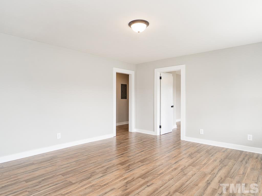 1235 South Main Street Graham, NC 27253 - Photo 33 of 33 a view of an empty room with wooden floor