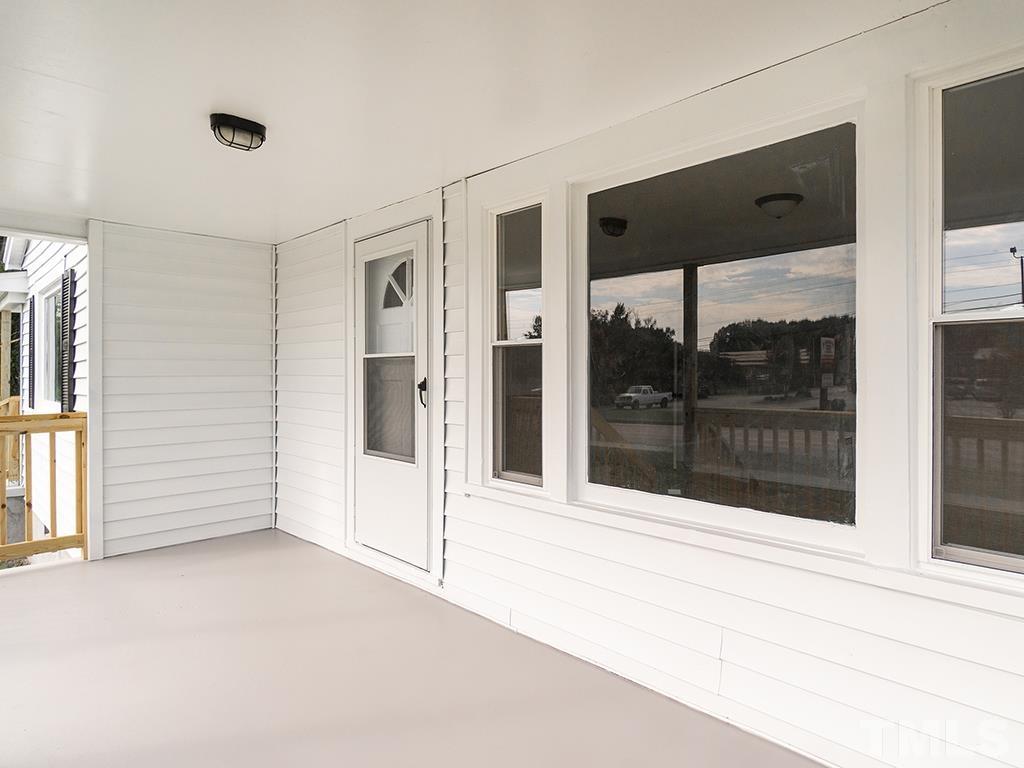 1235 South Main Street Graham, NC 27253 - Photo 10 of 33 a view of an empty room with a window