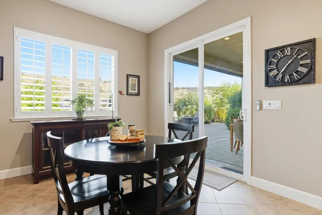 a dining room with furniture and window