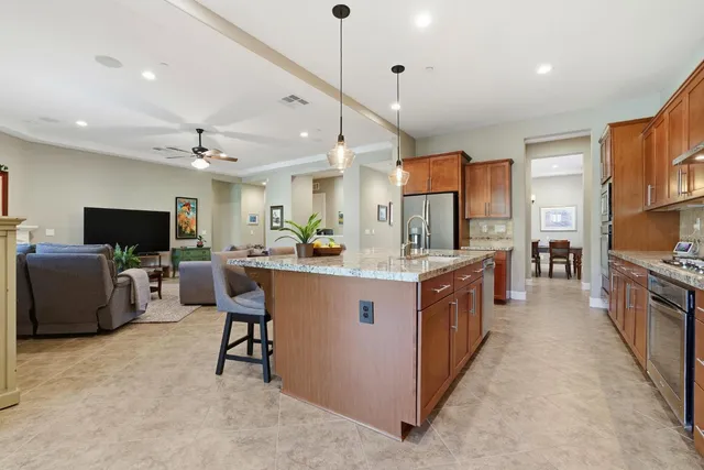 a large kitchen with a table and chairs