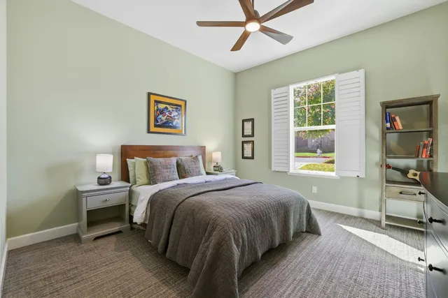 a bed room with a bed and a window