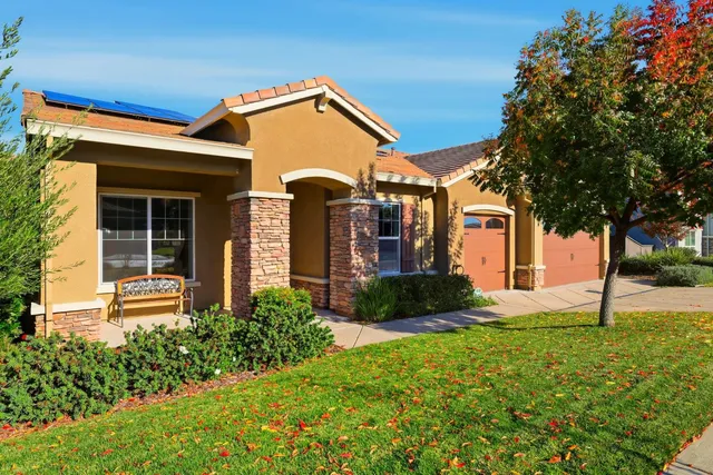 an aerial view of multiple house with a city view