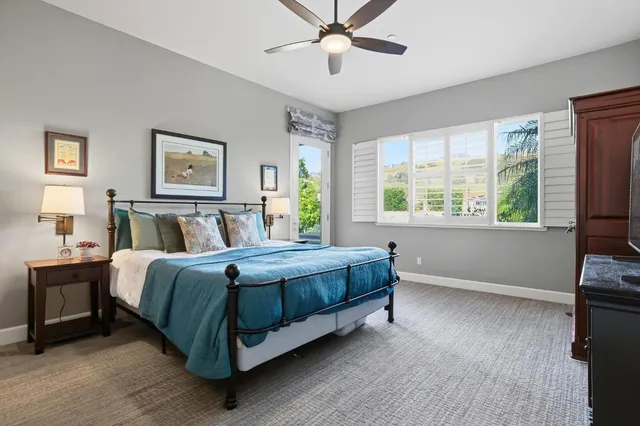 a bed room with a bed and a window