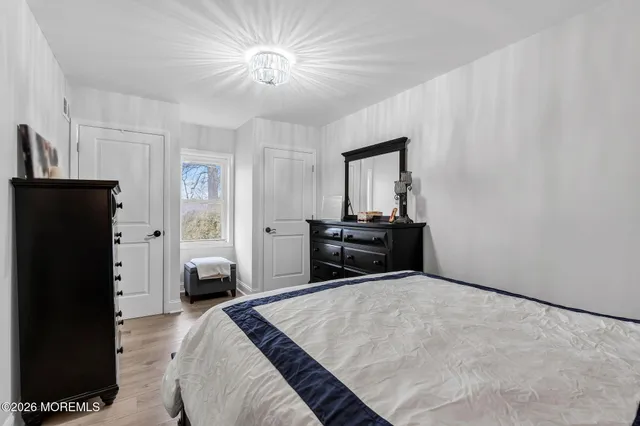 a view of a hallway with a bedroom