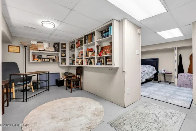 a bedroom with a bed and a couch