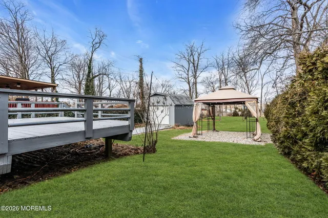 a view of a house with a backyard