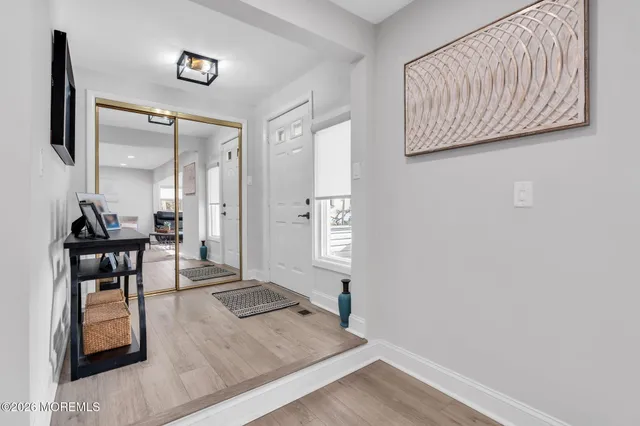 an entryway and livingroom with furniture