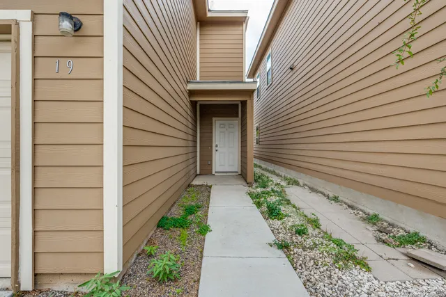 a view of a pathway with a house