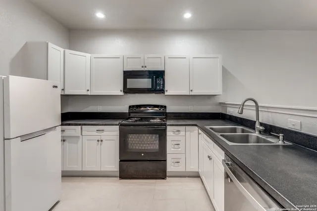 a bathroom with a sink toilet and a mirror