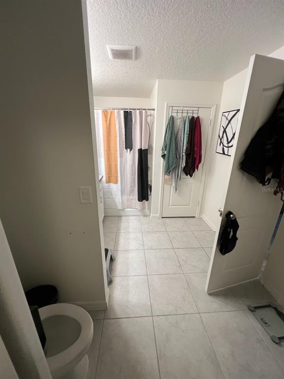 2489 Bulrush Drive St. Cloud, FL 34769 - Photo 13 of 22 a bathroom with a sink and toilet