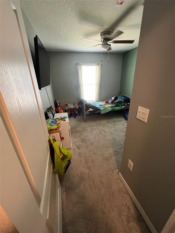 2489 Bulrush Drive St. Cloud, FL 34769 - Photo 15 of 22 a view of a room with gym equipment
