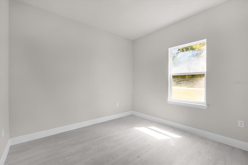 15782 Southwest 52nd Ave Road Ocala, FL 34473 - Photo 13 of 34 an empty room with a window