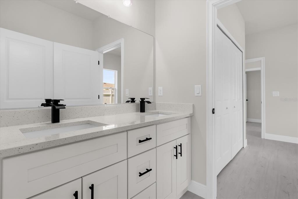 15782 Southwest 52nd Ave Road Ocala, FL 34473 - Photo 15 of 34 a bathroom with a sink and a mirror