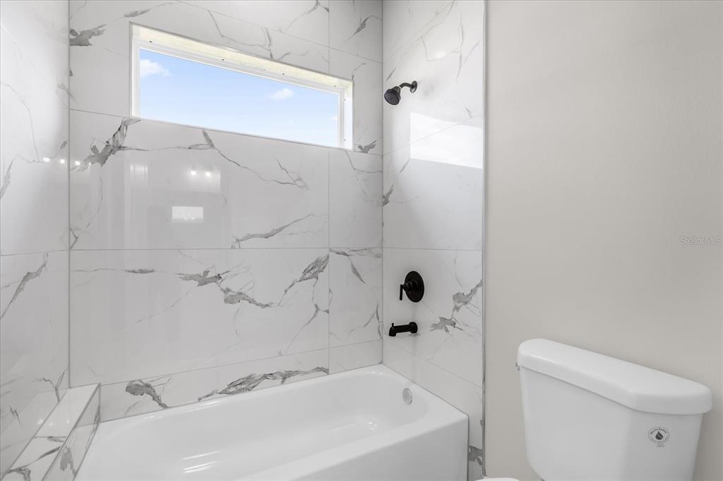 15782 Southwest 52nd Ave Road Ocala, FL 34473 - Photo 16 of 34 a bathroom with a sink and toilet