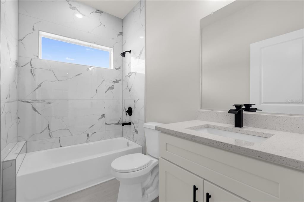 15782 Southwest 52nd Ave Road Ocala, FL 34473 - Photo 19 of 34 a bathroom with a sink a toilet and a bathtub