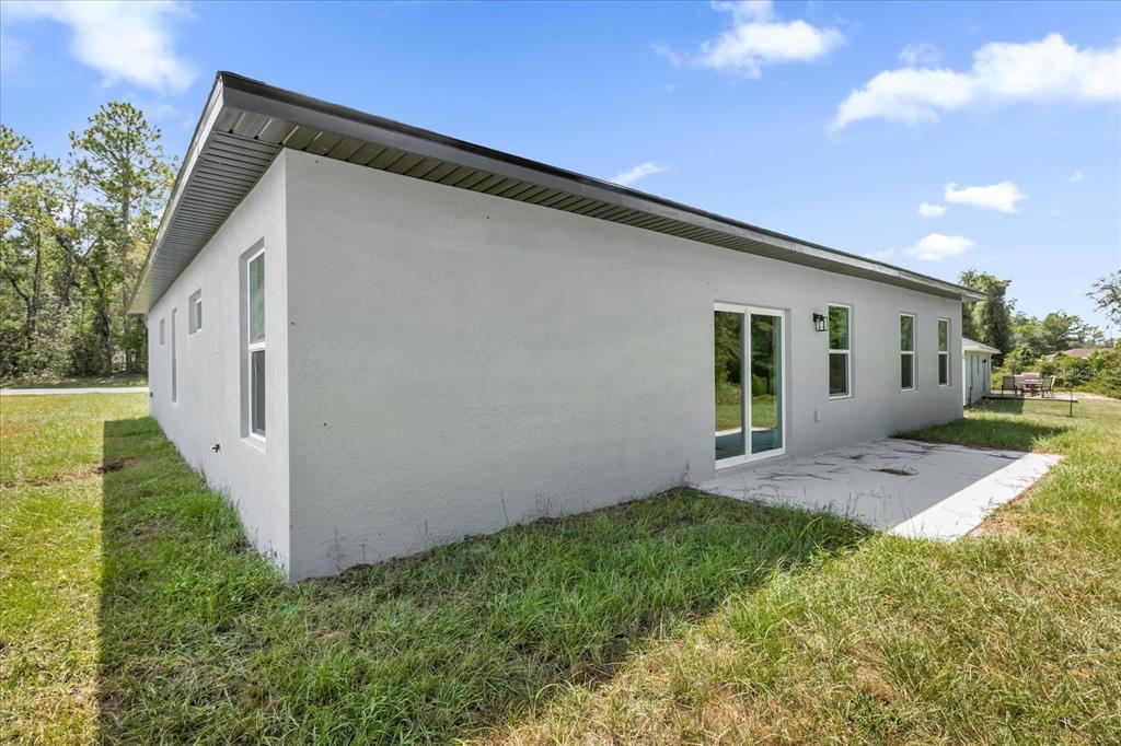 15782 Southwest 52nd Ave Road Ocala, FL 34473 - Photo 28 of 34 a view of a house with backyard and garden