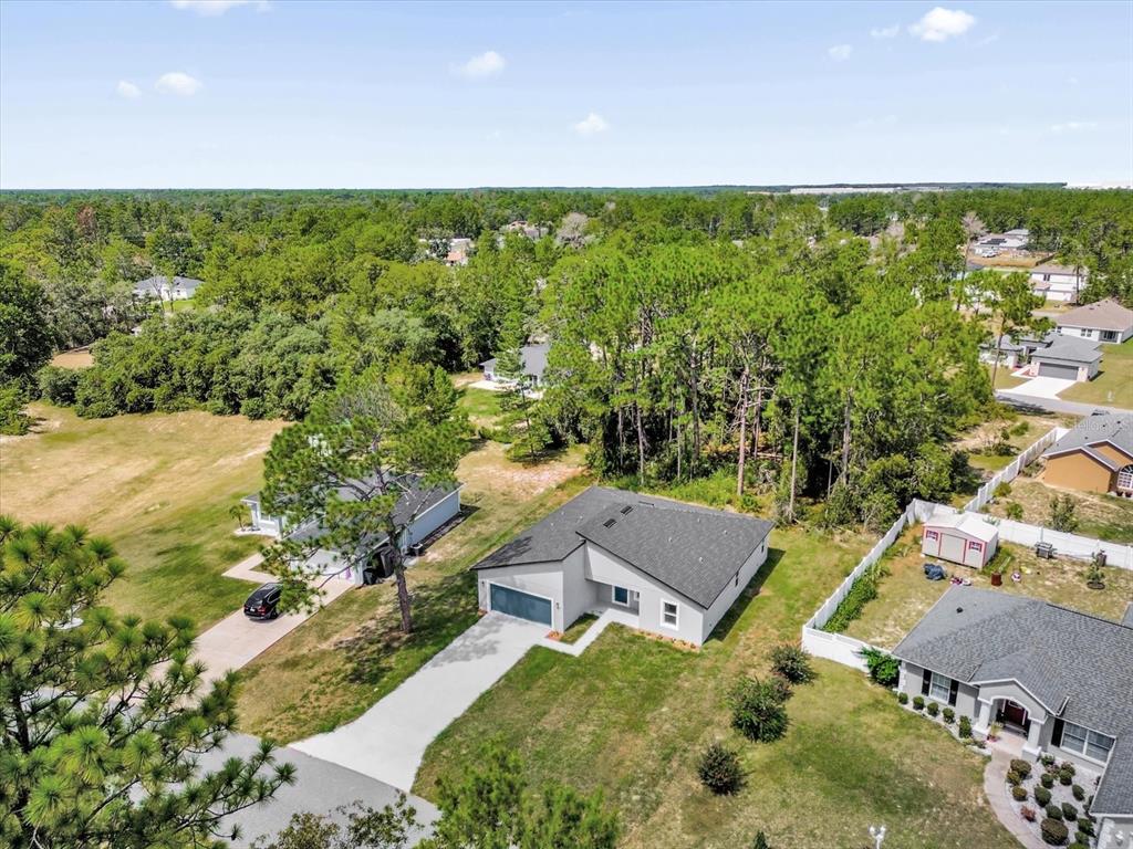 15782 Southwest 52nd Ave Road Ocala, FL 34473 - Photo 31 of 34 an aerial view of a house with a yard