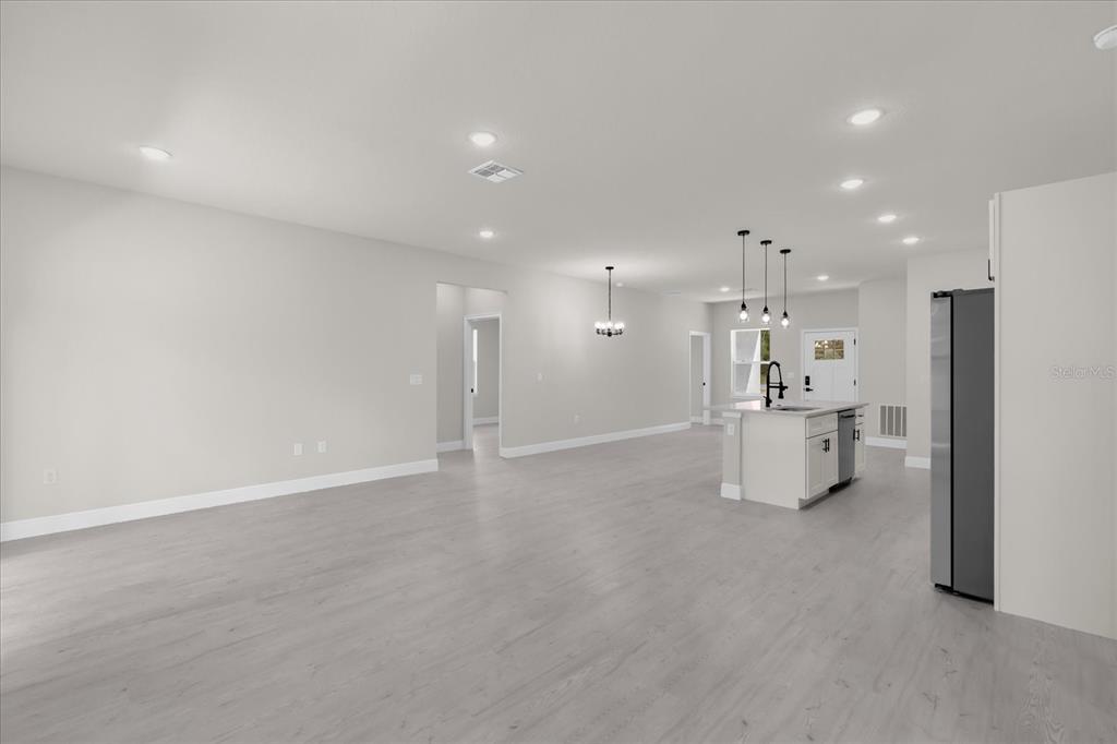 15782 Southwest 52nd Ave Road Ocala, FL 34473 - Photo 6 of 34 a view of a kitchen with refrigerator and a sink