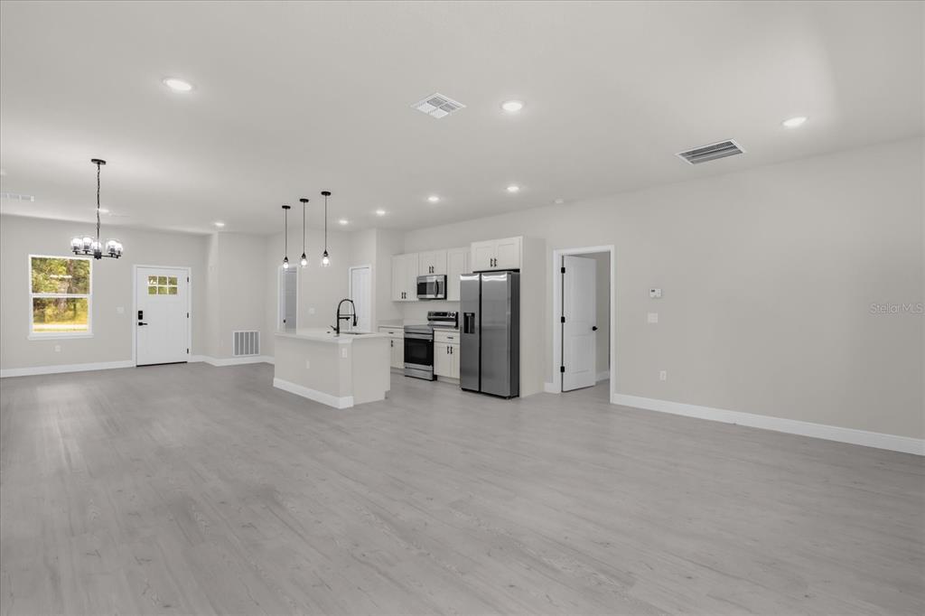 15782 Southwest 52nd Ave Road Ocala, FL 34473 - Photo 7 of 34 a view of a kitchen with a refrigerator and a window