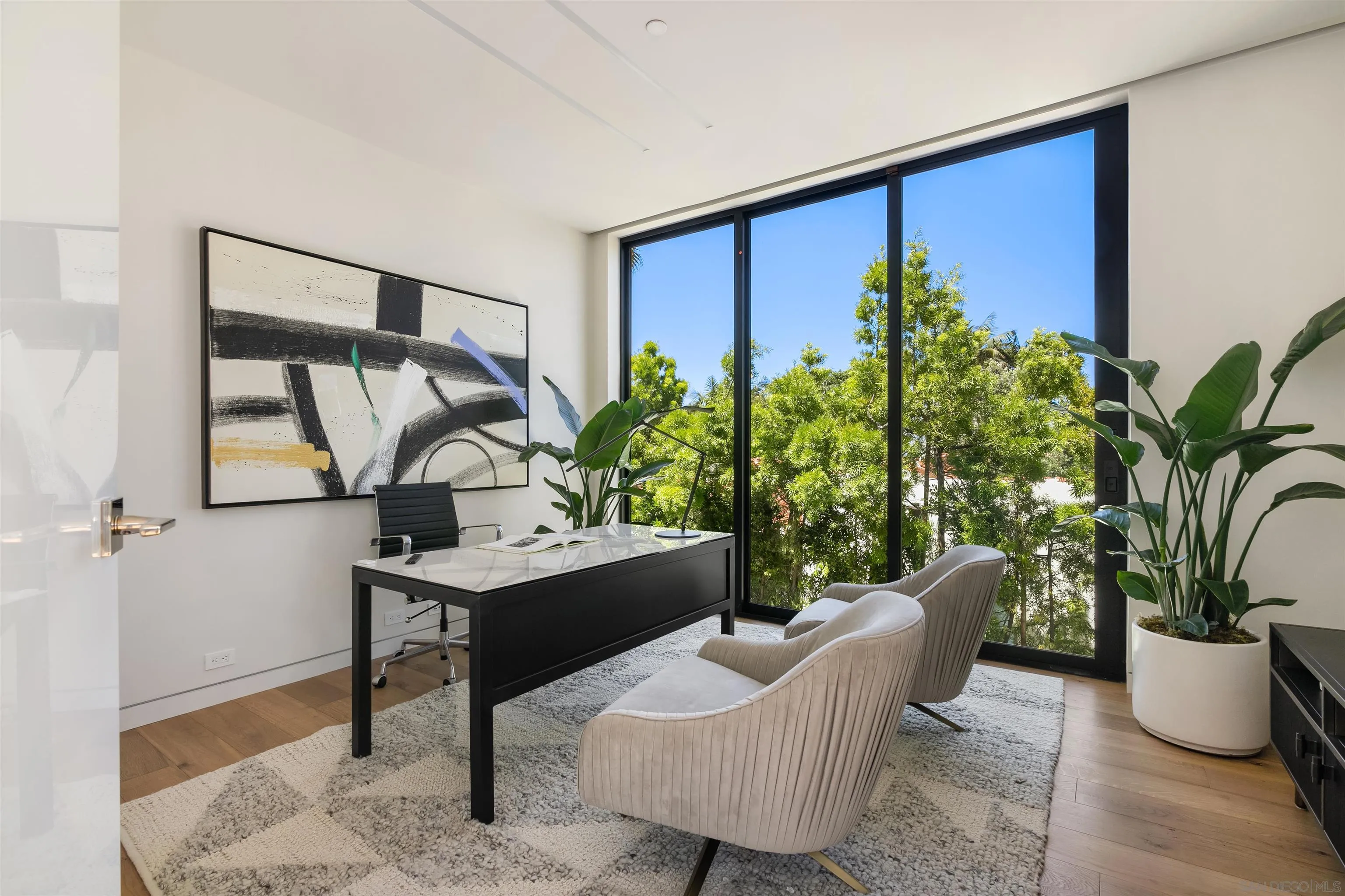 7837 Lookout Drive La Jolla, CA 92037 - Photo 24 of 46 a living room with furniture and a potted plant