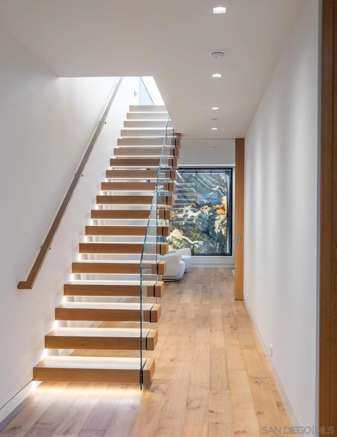7837 Lookout Drive La Jolla, CA 92037 - Photo 26 of 46 a view of entryway and hall with wooden floor