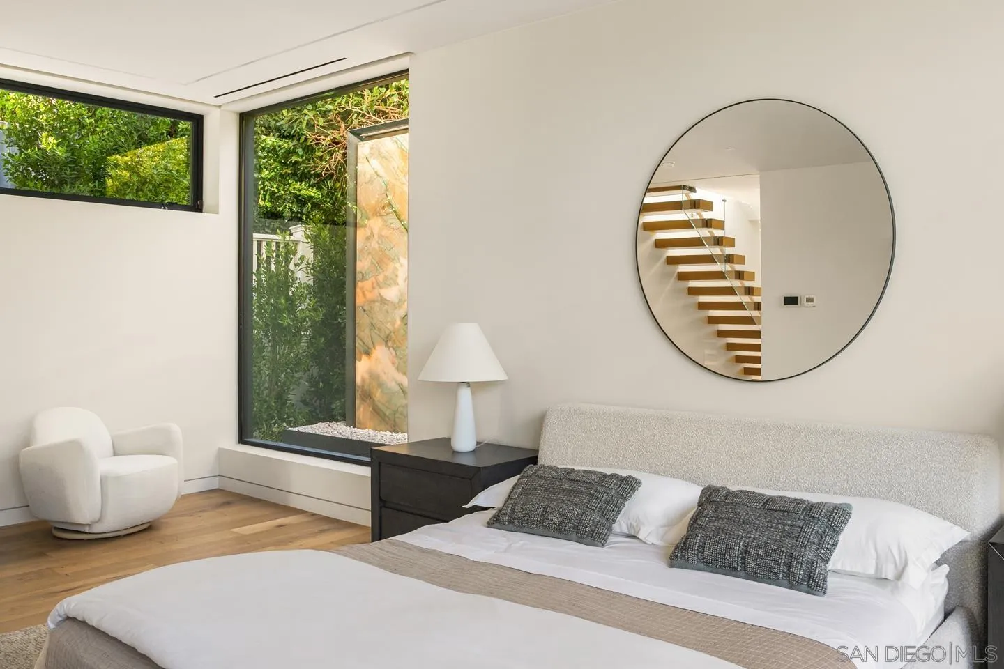 7837 Lookout Drive La Jolla, CA 92037 - Photo 32 of 46 a bedroom with bed and a window