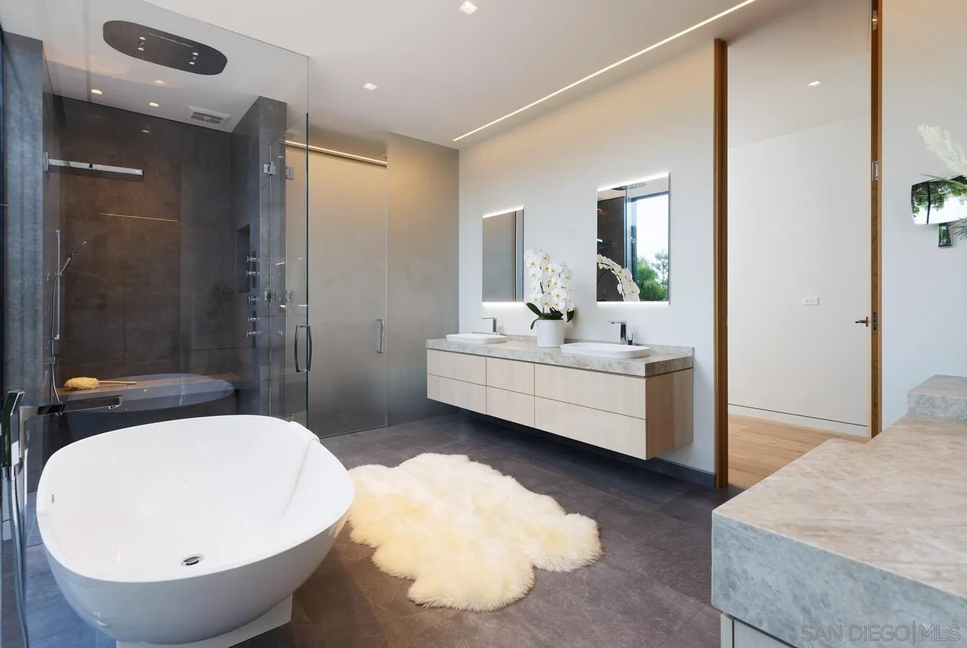 7837 Lookout Drive La Jolla, CA 92037 - Photo 34 of 46 a bathroom with a bathtub and a sink