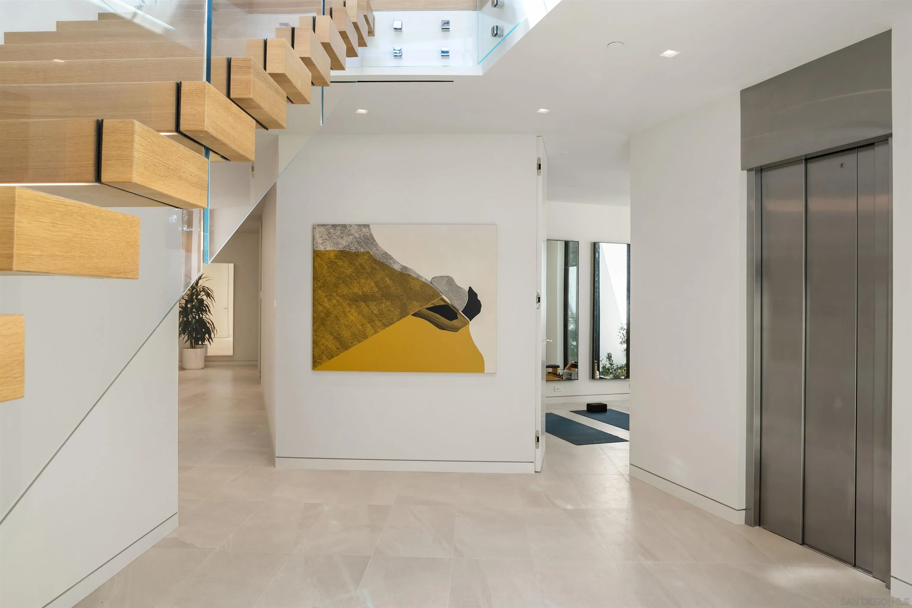 7837 Lookout Drive La Jolla, CA 92037 - Photo 36 of 46 a view of a hallway with staircase