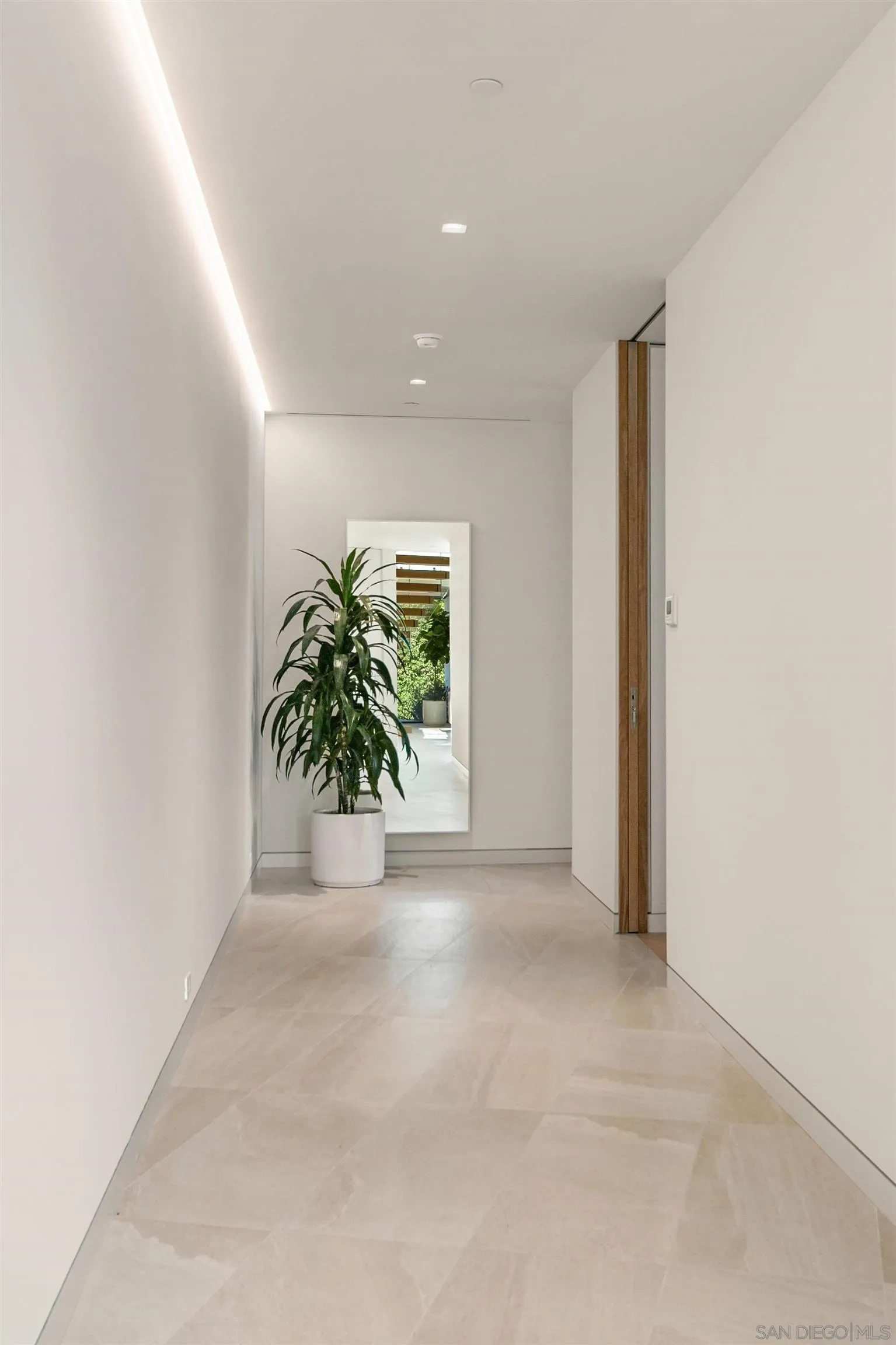 7837 Lookout Drive La Jolla, CA 92037 - Photo 37 of 46 a view of a hallway with potted plants