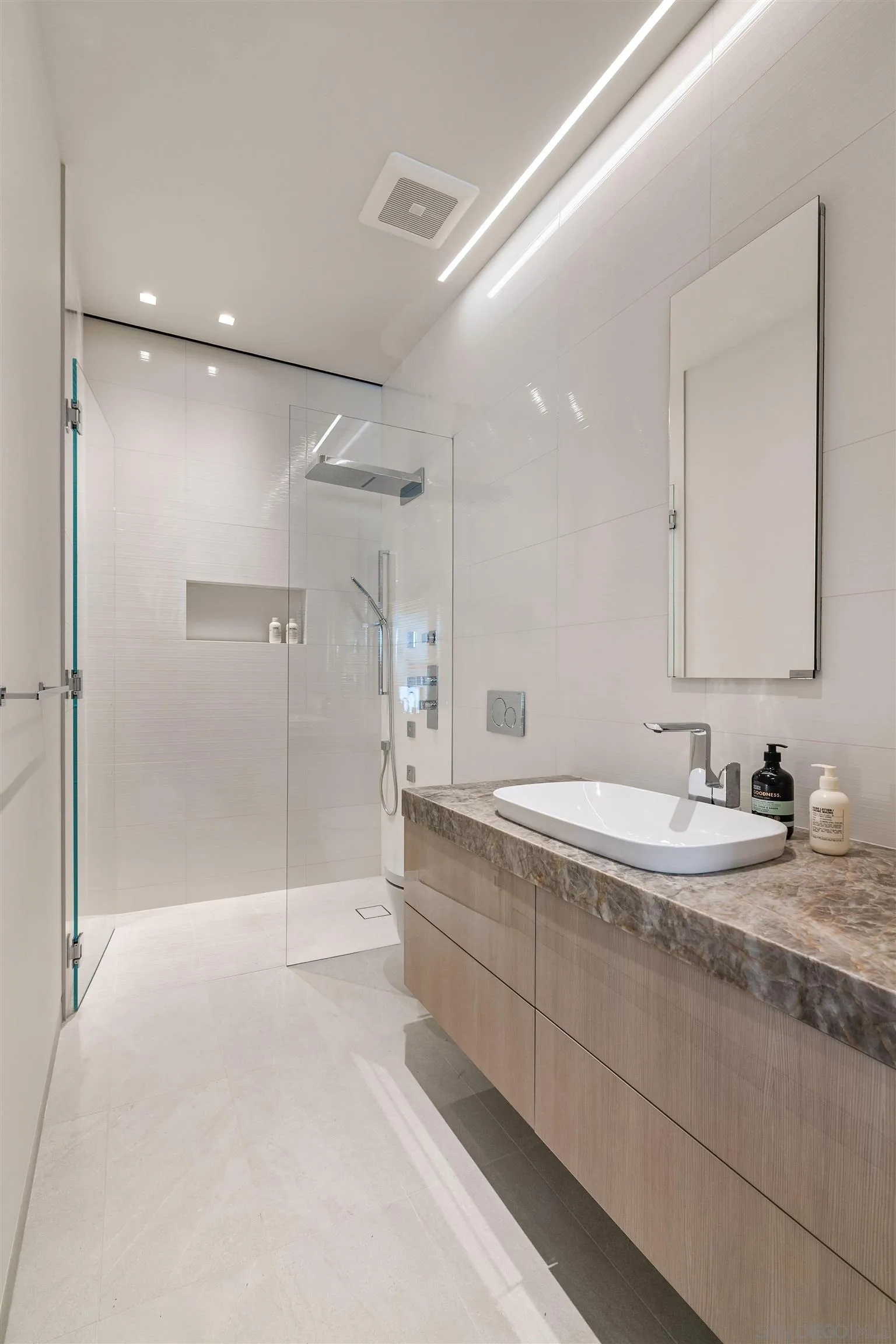 7837 Lookout Drive La Jolla, CA 92037 - Photo 44 of 46 a bathroom with a granite countertop sink mirror and double
