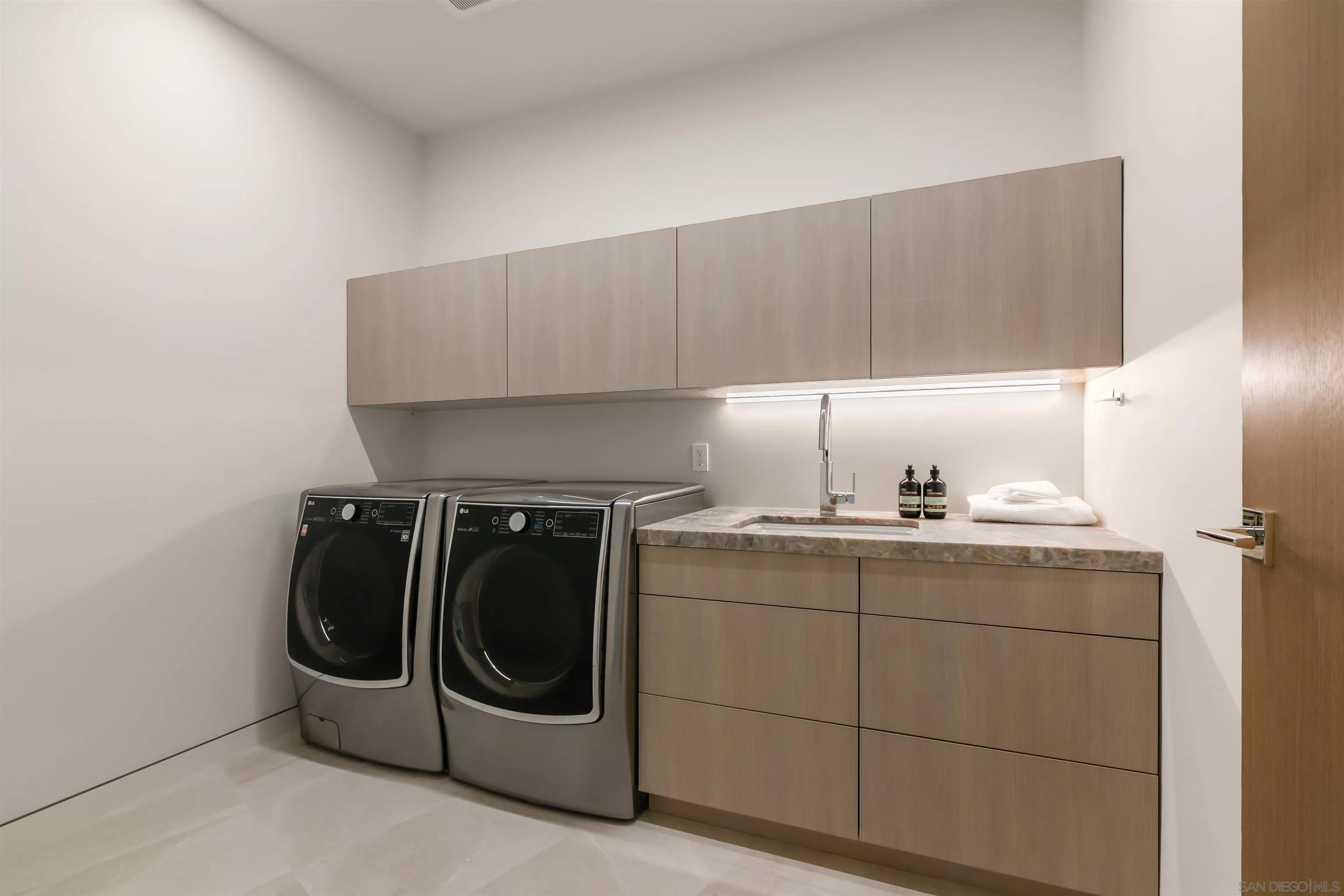7837 Lookout Drive La Jolla, CA 92037 - Photo 45 of 46 a utility room with dryer and washer