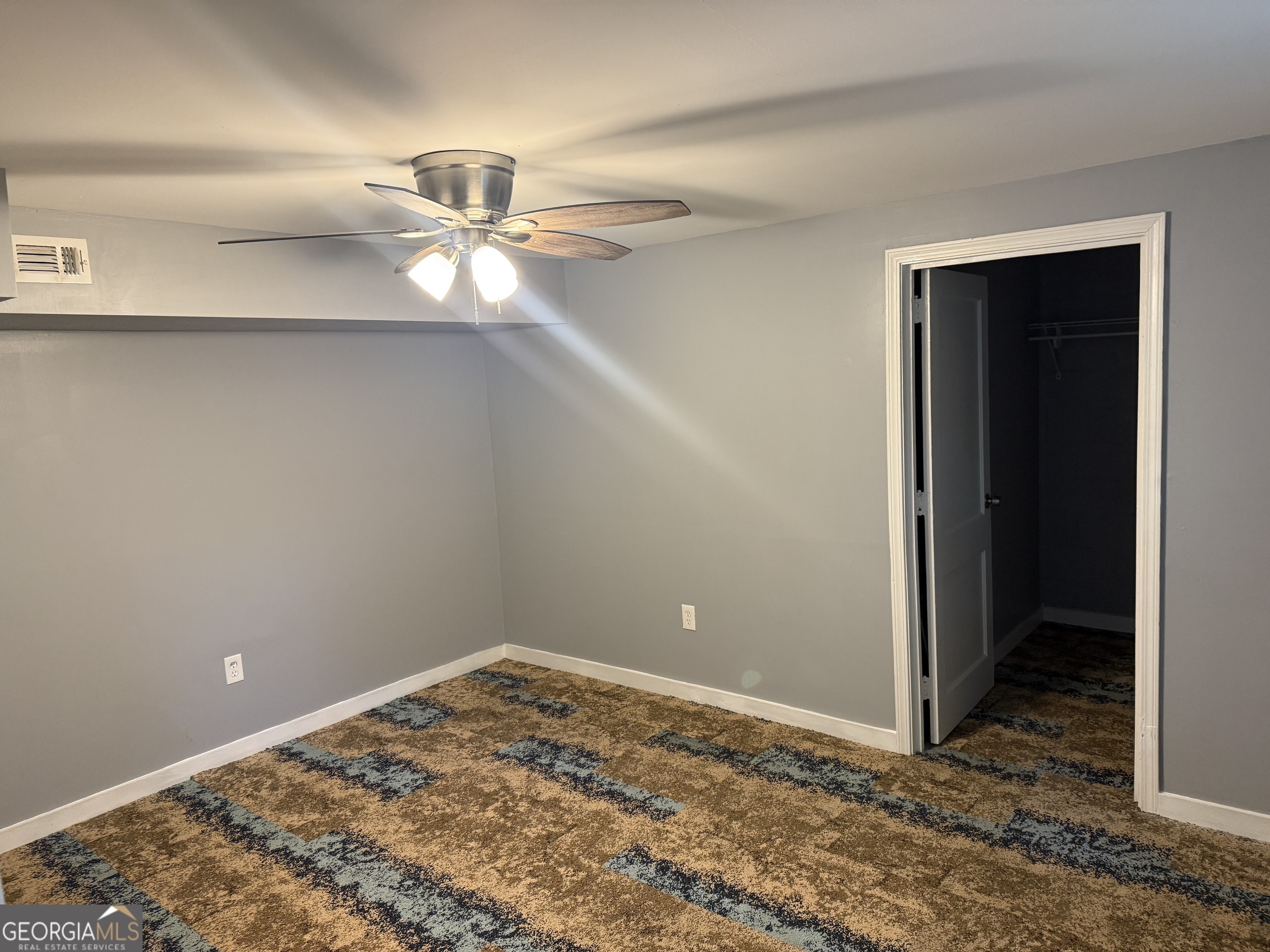 5047 West Point Road LaGrange, GA 30240 - Photo 11 of 22 a view of a room with a ceiling fan and closet