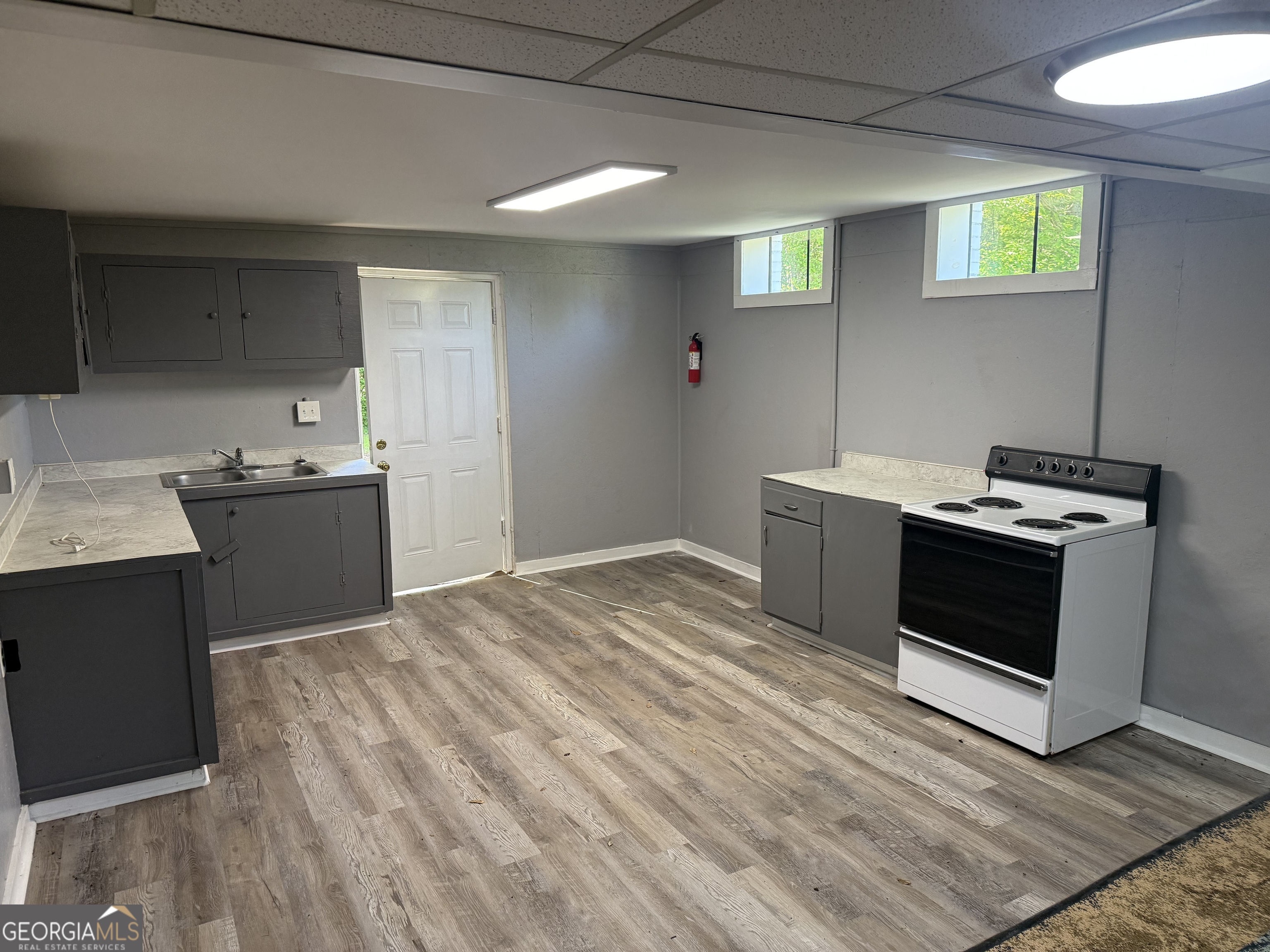 5047 West Point Road LaGrange, GA 30240 - Photo 19 of 22 a kitchen with a stove and a sink