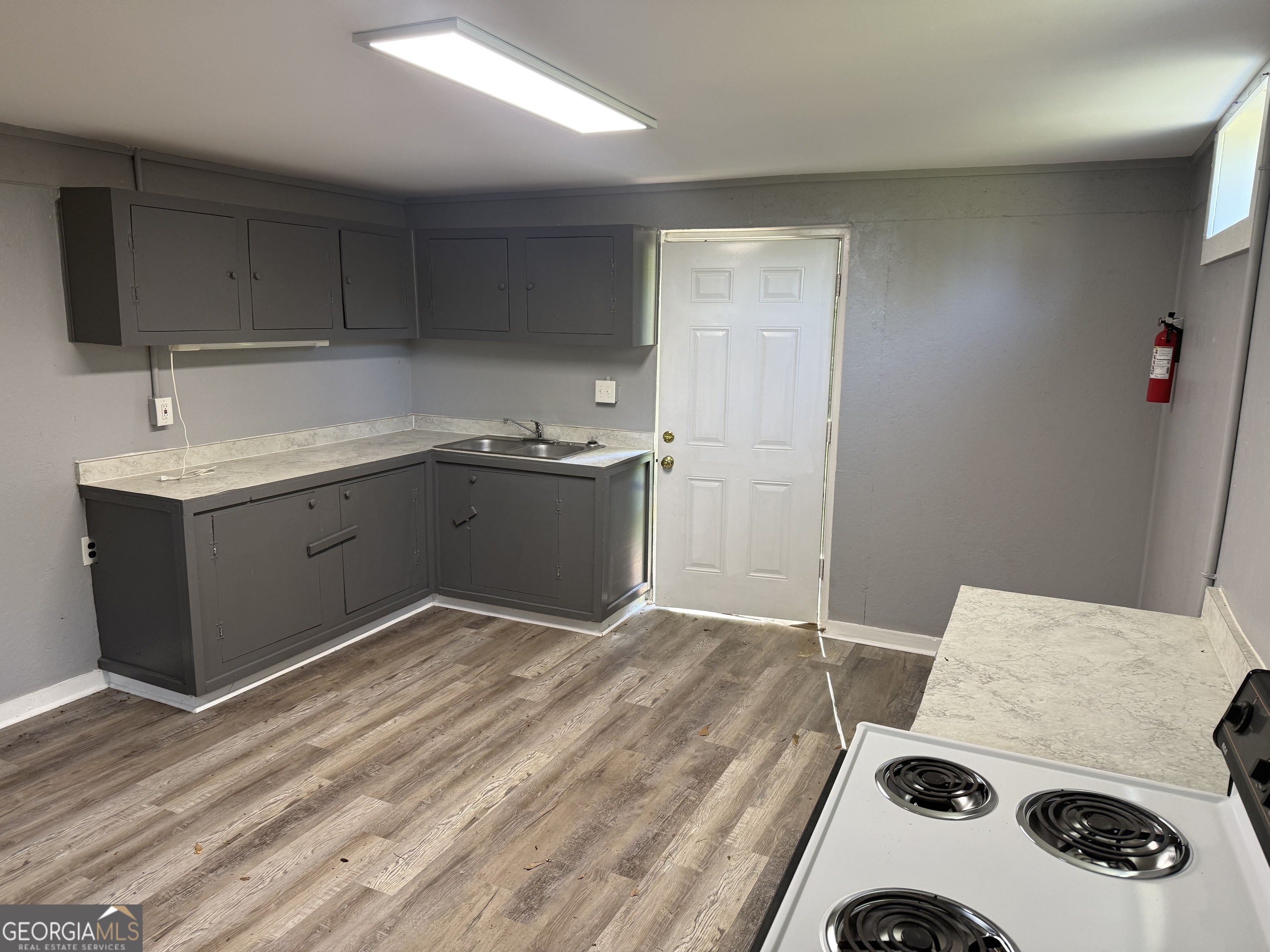 5047 West Point Road LaGrange, GA 30240 - Photo 20 of 22 a room with a sink and cabinets