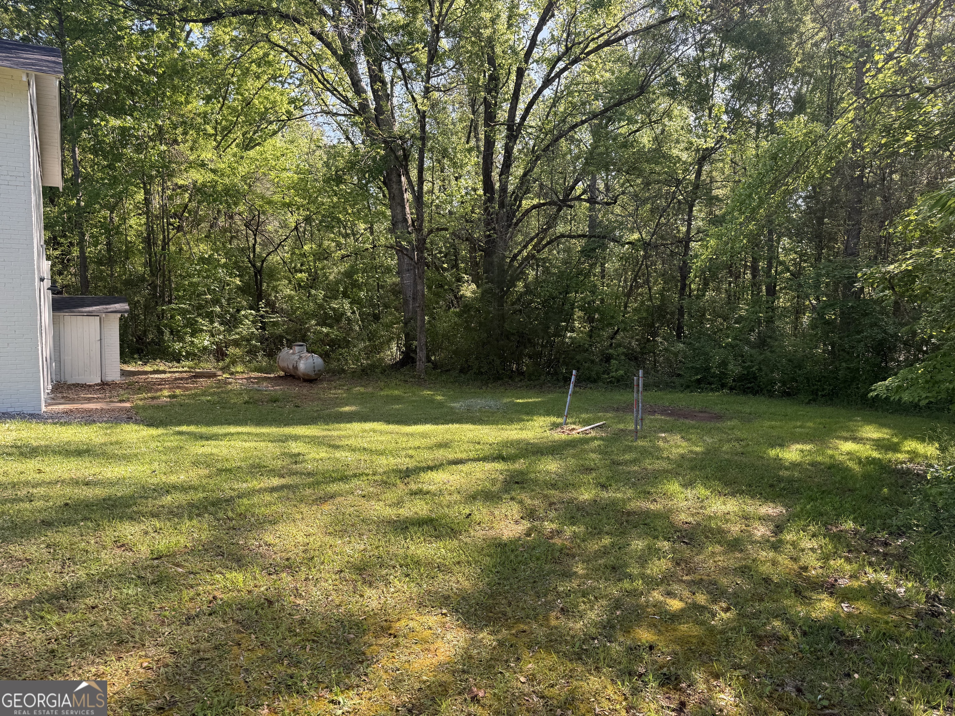 5047 West Point Road LaGrange, GA 30240 - Photo 21 of 22 a view of a yard with a trees
