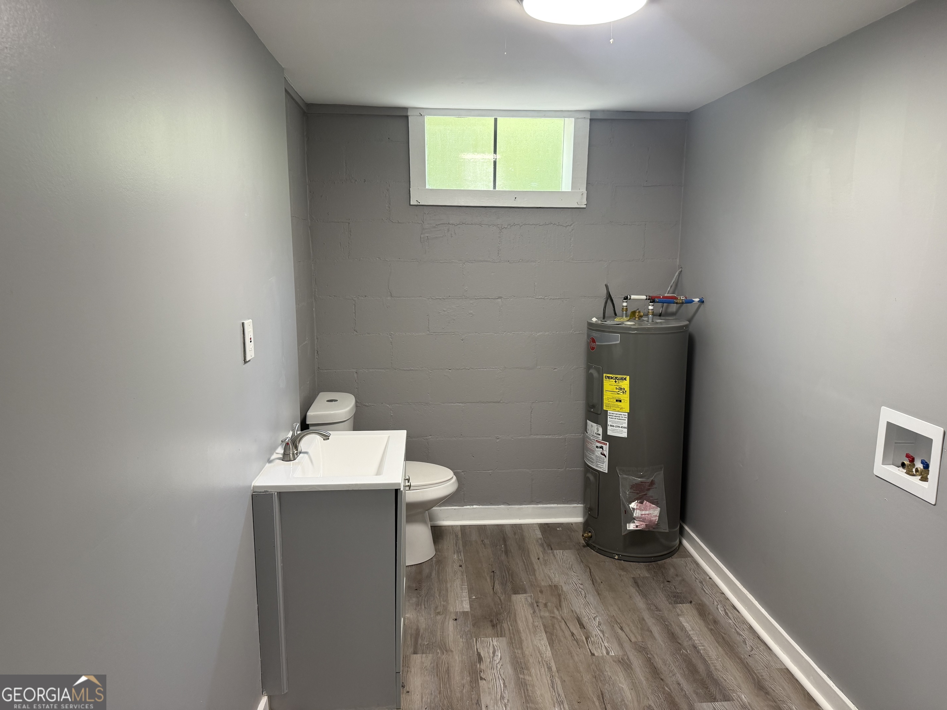 5047 West Point Road LaGrange, GA 30240 - Photo 5 of 22 a bathroom with a sink and a toilet