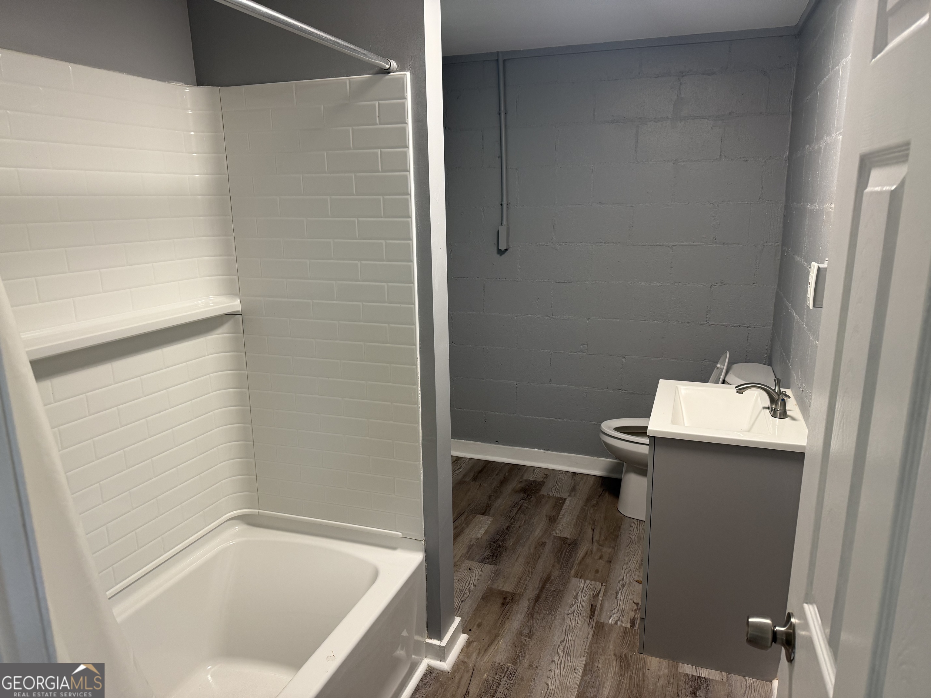 5047 West Point Road LaGrange, GA 30240 - Photo 7 of 22 a bathroom with a sink and mirror
