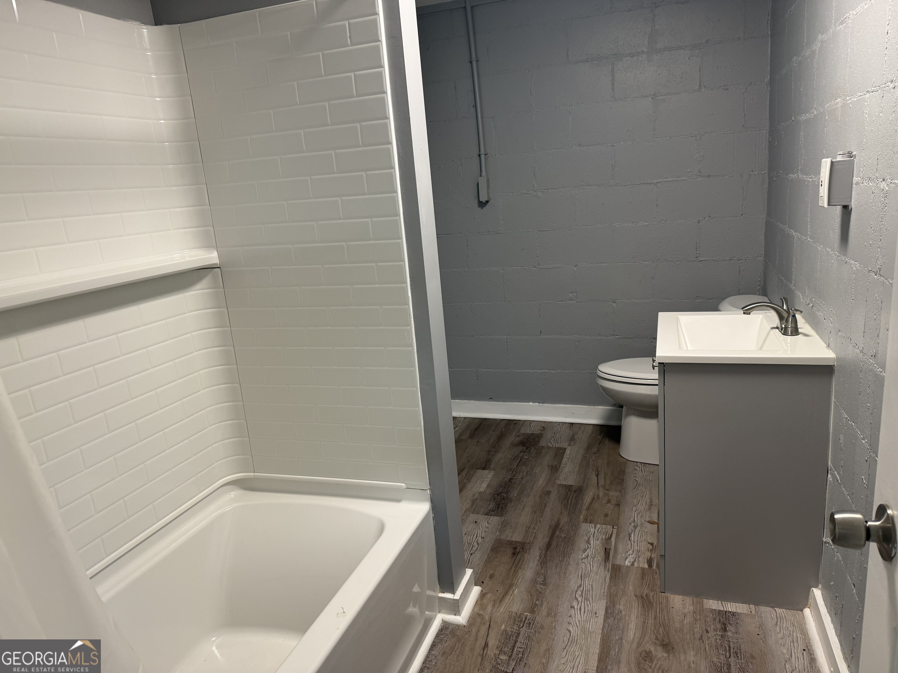 5047 West Point Road LaGrange, GA 30240 - Photo 9 of 22 a bathroom with a sink a toilet and shower