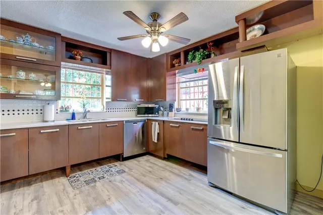 a view of a dining room with furniture and wooden floor