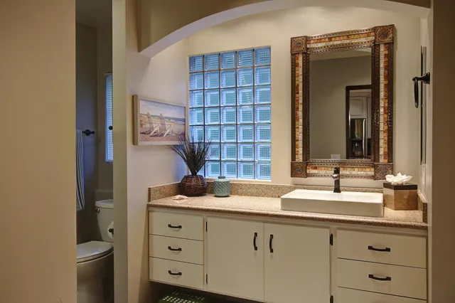 a bathroom with a sink and a mirror