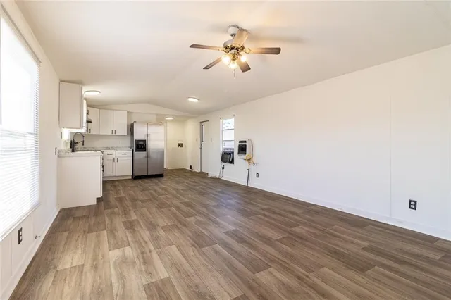 a view of a kitchen with a microwave and a stove
