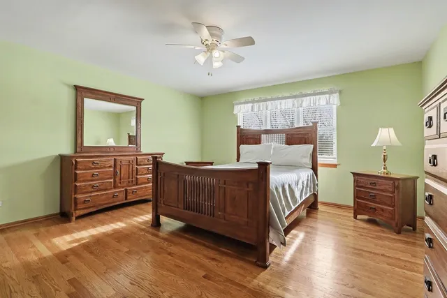 a bedroom with a bed and a dresser