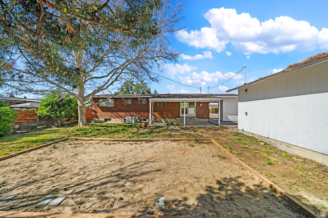 2267 West 4350th Street South Roy, UT 84067 - Photo 31 of 32 Back of house with a patio area
