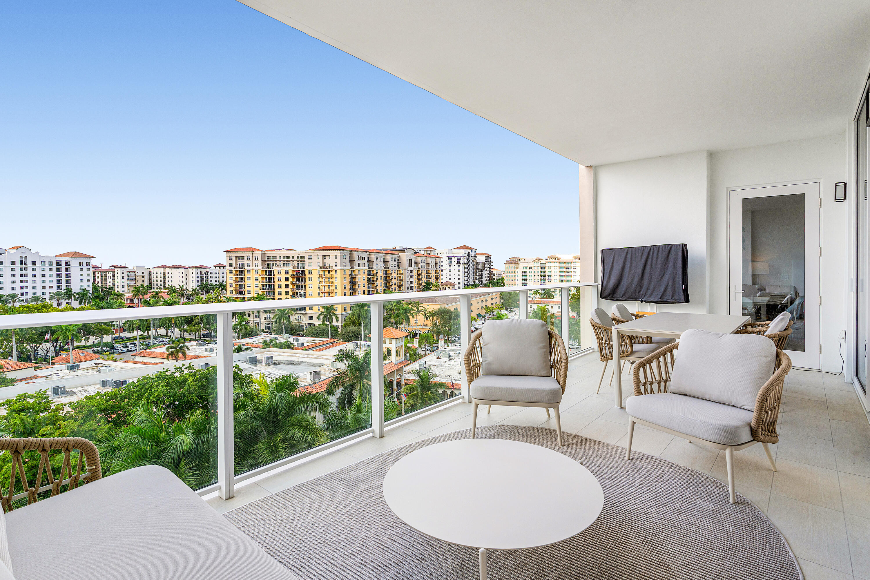 220 Southeast Mizner Boulevard, Unit 810 Boca Raton, FL 33432 - Photo 11 of 39 a view of a chairs and table in patio