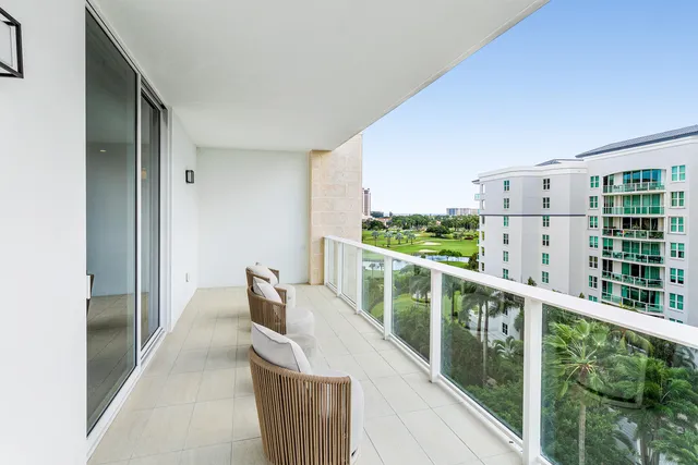a view of balcony with furniture