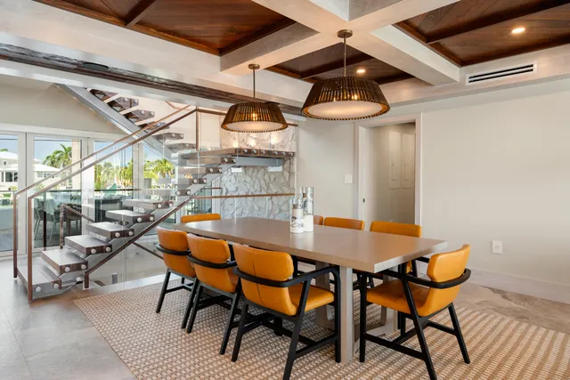 a living room with furniture fireplace and kitchen view