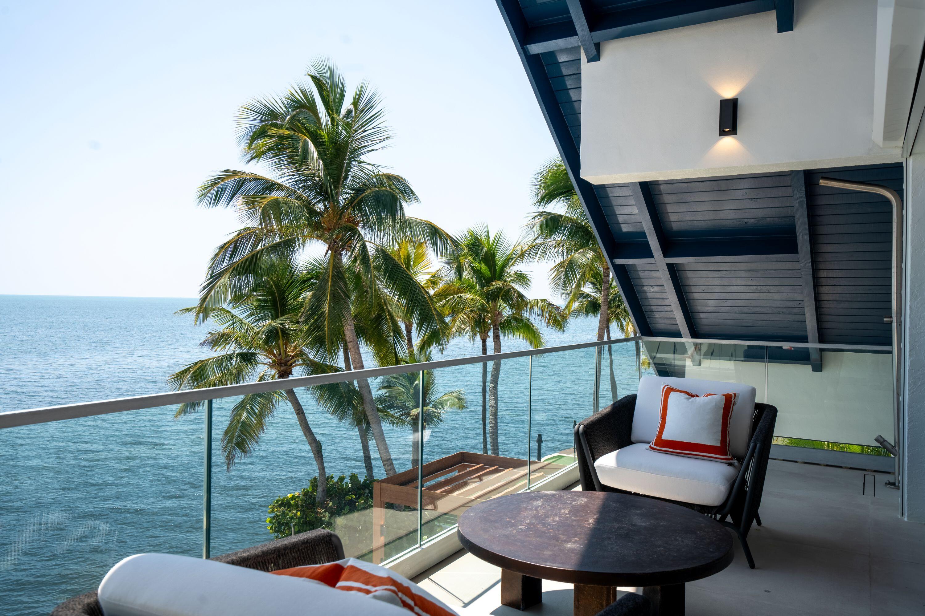 555 Ocean Cay Key Largo, FL 33037 - Photo 24 of 46 a balcony with table and chairs